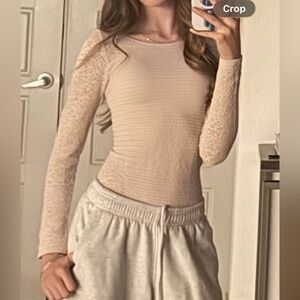 Body suit free people in a creamy pink with lace detail!!